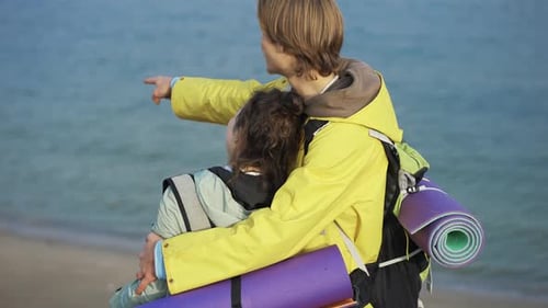 Happy Couple Embracing on a Beach on a Sunny Day