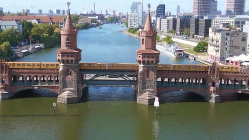 Suburban train Summer day east west Berlin Border River Bridge Germany. Perfect aerial top view flig
