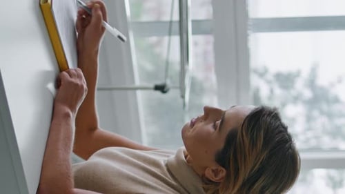 Confident Woman Filling Agreement for Procedures in Cosmetology Clinic Vertical