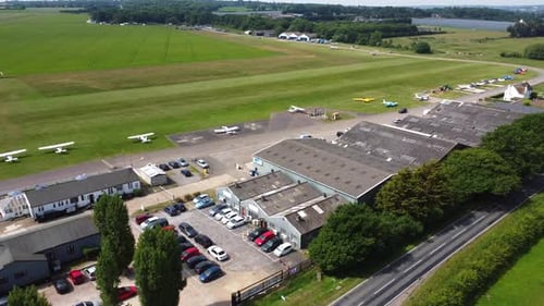 Aerial view of Stapleford Airport hangers, aircraft and flight line, Essex, UK