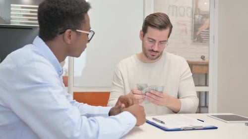 African Man Gives Money and Shakes Hand in Office
