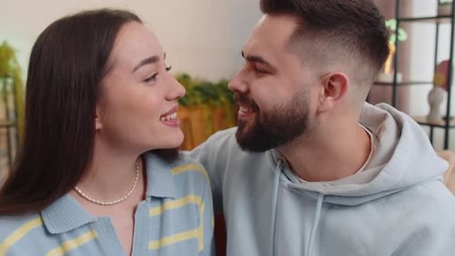 Loving Couple Embraces Affectionately Indoors