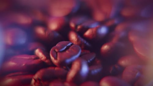 Falling Coffee beans extreme closeup dolly shot in warm light