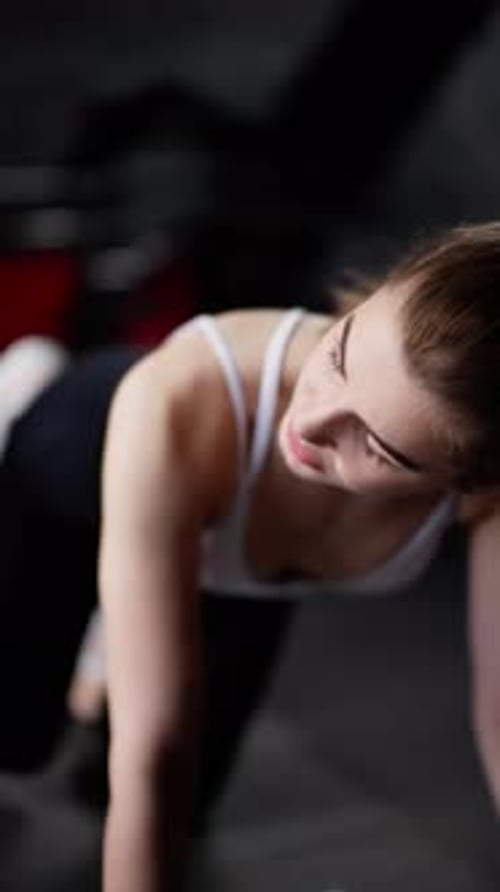Woman Doing Glute Exercises in Gym