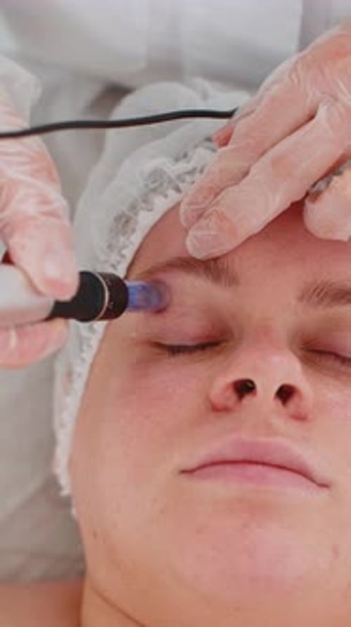 Woman Receiving Cosmetic Facial Treatment Close Up