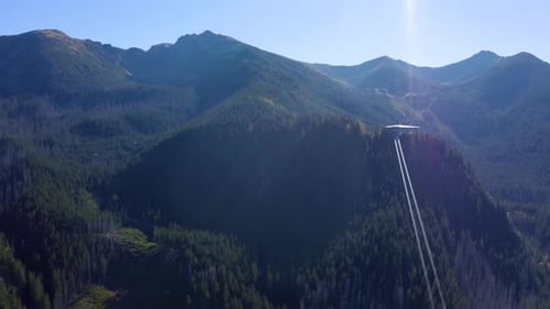 Ropeway, cable car cabins. Ski lifts. Aerial Lift Pylon and Cable Car.