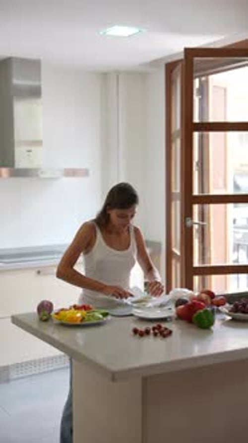 Woman Preparing Healthy Meal in Bright Kitchen
