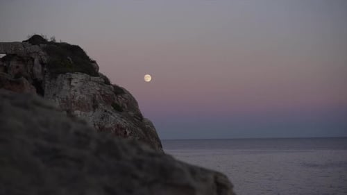 Sunset in Mallorca with the Moon in the Background
