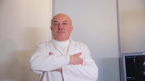 Experienced Senior Ultrasound Doctor Standing in Office on White Background