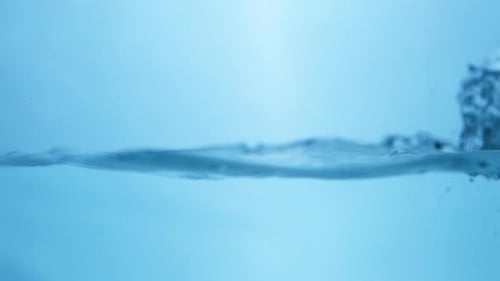 Water waves on surface with blue background_slow motion