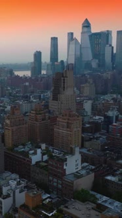 Unbelievable panorama of stunning New York architecture against beautiful orange sky.