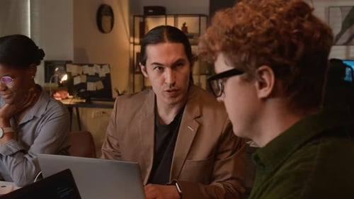 Multiethnic Programmers Collaborating on Code in Office