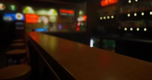 Cozy Bar Atmosphere with Vibrant Neon Lights and Wooden Counter