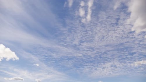 Blue sky with cirrus and cumulus clouds.