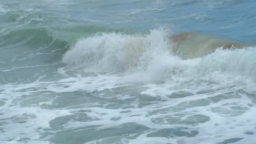 Dramatic tube wave on a stormy day. Beautiful cinematic slow motion footage.