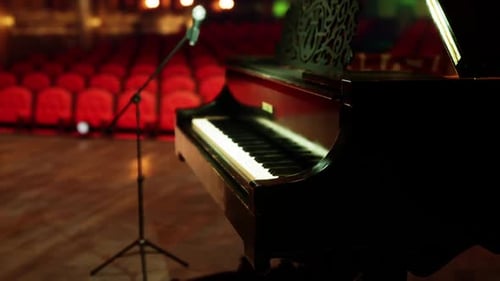 Elegant Grand Piano and Microphone on Empty Concert Stage