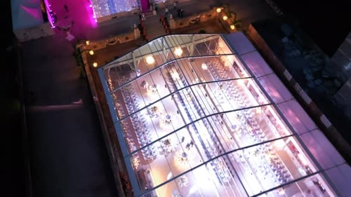 Aerial Shot From Above Colorfull Dance Hall with Lots of Lights Wedding Party Big Crowd at Night