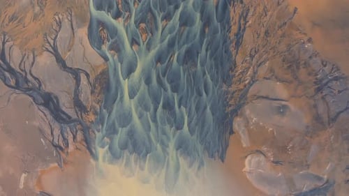 Aerial video over YELLOW RIVER and flowing glaciers in Iceland landscape