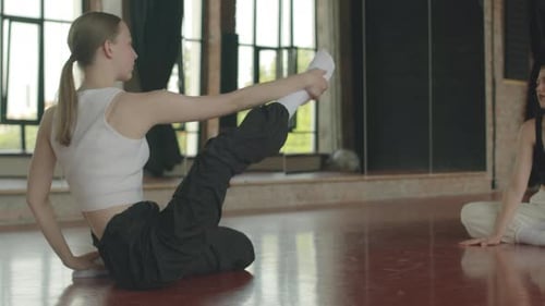 Female Stretching Coach Giving Individual Class at Studio