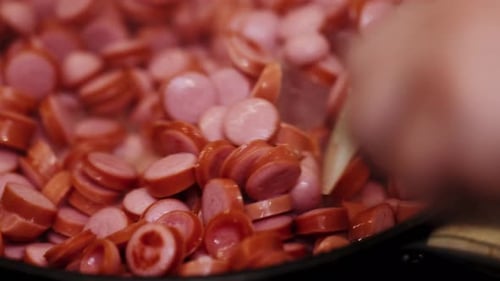 Sausage Cuts Frying on Pan Cut Sausages Frying in Pan in Hot Sizzling Oil Top View Shot of Roasting