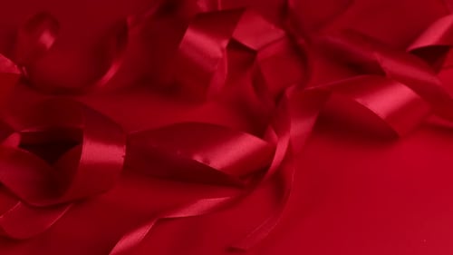Elegant Deep Red Ribbon Looping Abstract Background