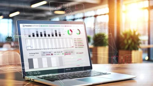 Laptop Showing Trading Platform with Graphs and Exchange Rate in Modern Office