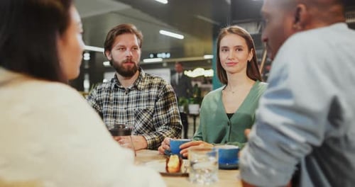 Friends Enjoying Coffee and Conversation Together