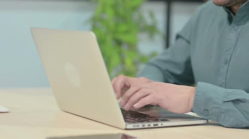 Close up of Hands Typing on Laptop