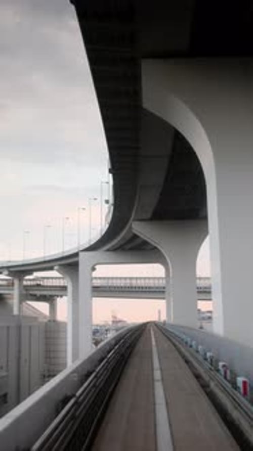 Tokyo Monorail Passing Through the City's Skyscapers in Vertical