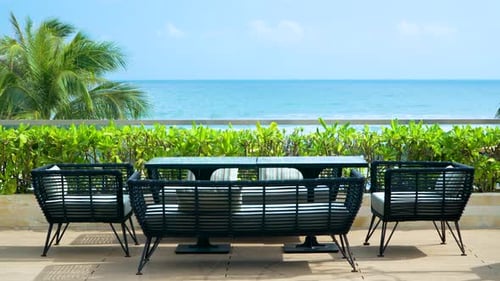 Sea view beside terrace and modern furniture in luxury tropical rooftop house