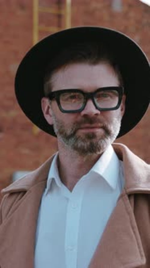 Stylish Man Smiling in City Fashion Portrait