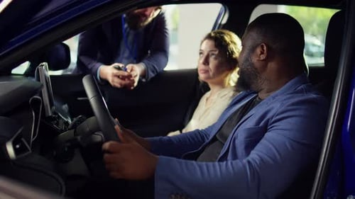 Clients Going on Test Drive Before Buying Car Receiving Keys From Salesman
