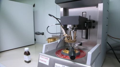 Lab Equipment with Wires and Small Metal Cups