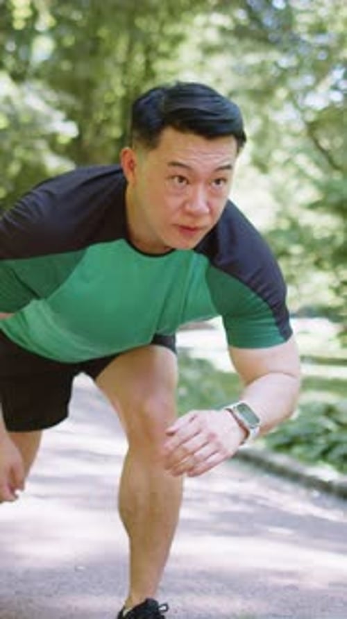 Asian Athletic Sport Motivated Runner Man Training Preparing to Run Race Marathon in Morning Park