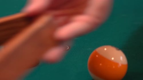 Person Racks 8 Ball Pool Triangle Closeup on the Spot then Rearranges Solid and Stripped Billiard Ba