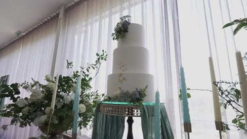 Elegant Wedding Cake with Flowers and Candles