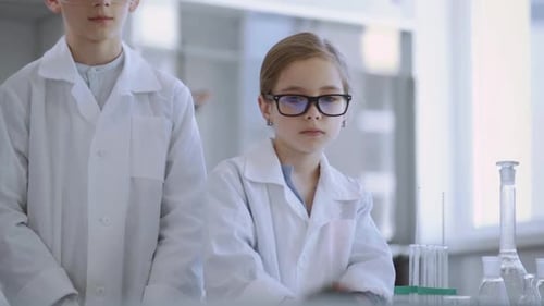 Children Standing in Bright Science Laboratory