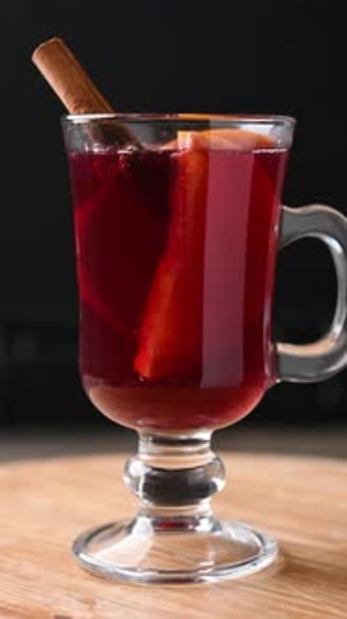 Elegant Mulled Wine with Cinnamon on Wooden Surface