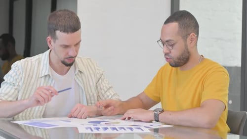 Mixed Race People Doing Paperwork in Office