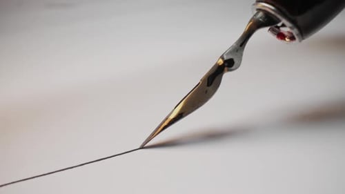 Classic Writing Instrument Fountain Pen Nib In Macro Black Ink Flow on Paper