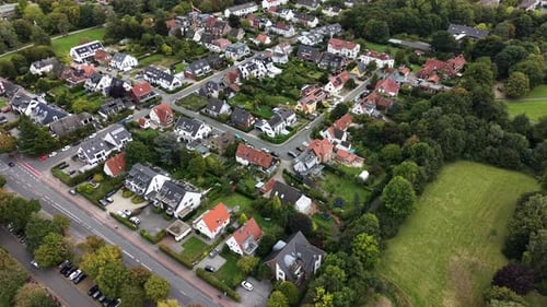 Drone flight over property and houses real estate in german or american town. Cloudy day in autumn.