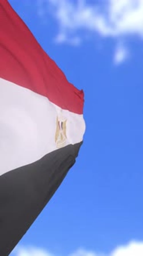 Egyptian Flag Waving in a Clear Blue Sky