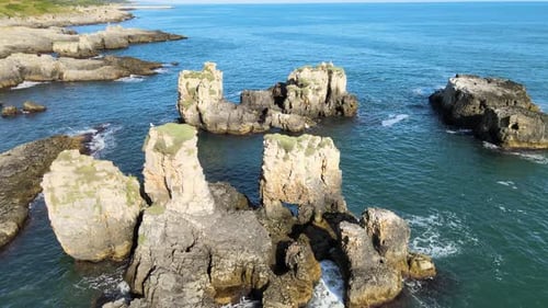 aerial rocks waves sea