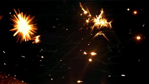 Golden Sparks and Embers Bursting on Black