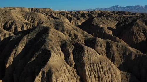 Drone footage flying over the rocky cliffs in the valley of Charyn Canyon in Kazakhstan