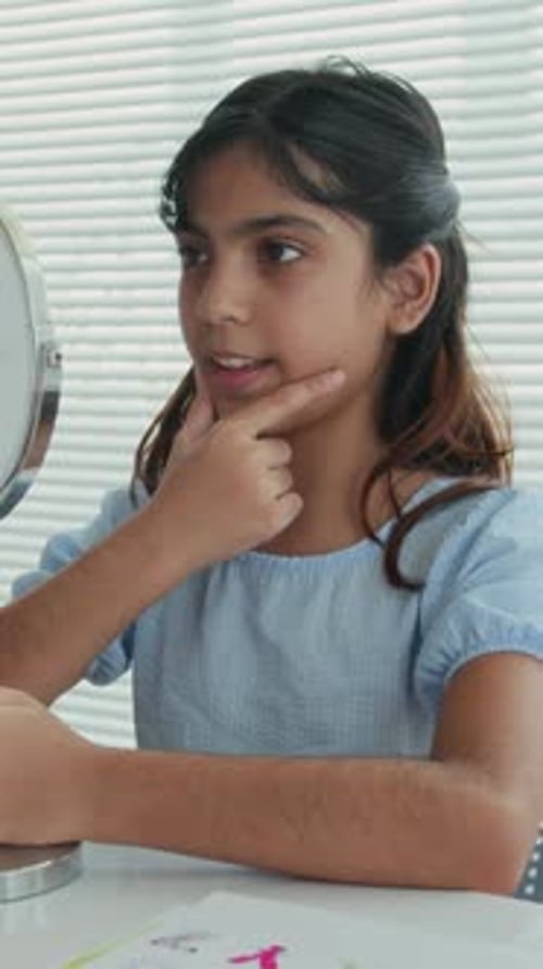 Kid Training Correct Pronunciation of Sounds by Mirror