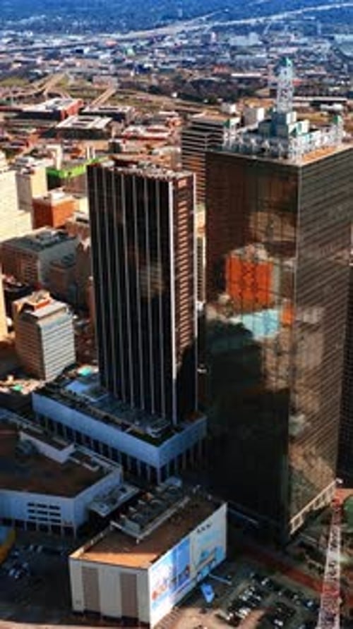 A group of diverse buildings standing close to each other in the downtown of Dallas