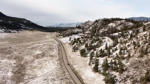 Breathtaking Winter Views: Barnhartvale Road in Kamloops amidst Snow-Covered Mountainous Terrain