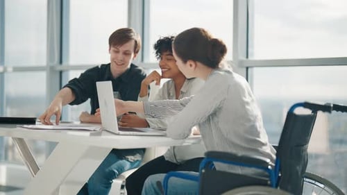 Young Business Woman Sitting Wheelchair While Work Young Business People Working in Office Workplace