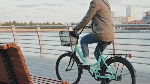 Female Office Worker Riding Bicycle